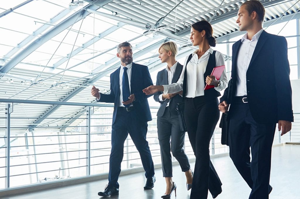 coworkers walking through an office building