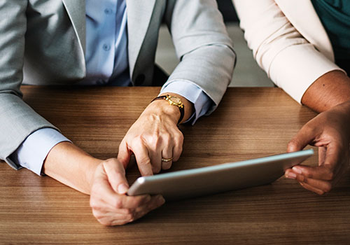 employees working together on an iPad