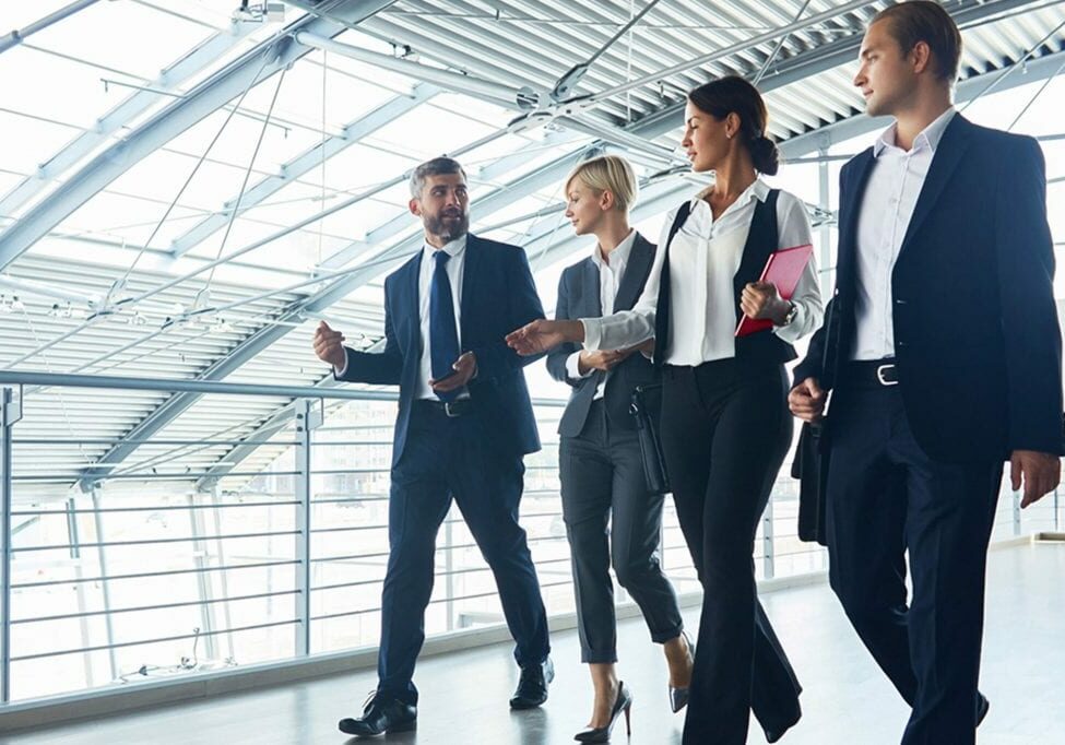 coworkers walking through an office building